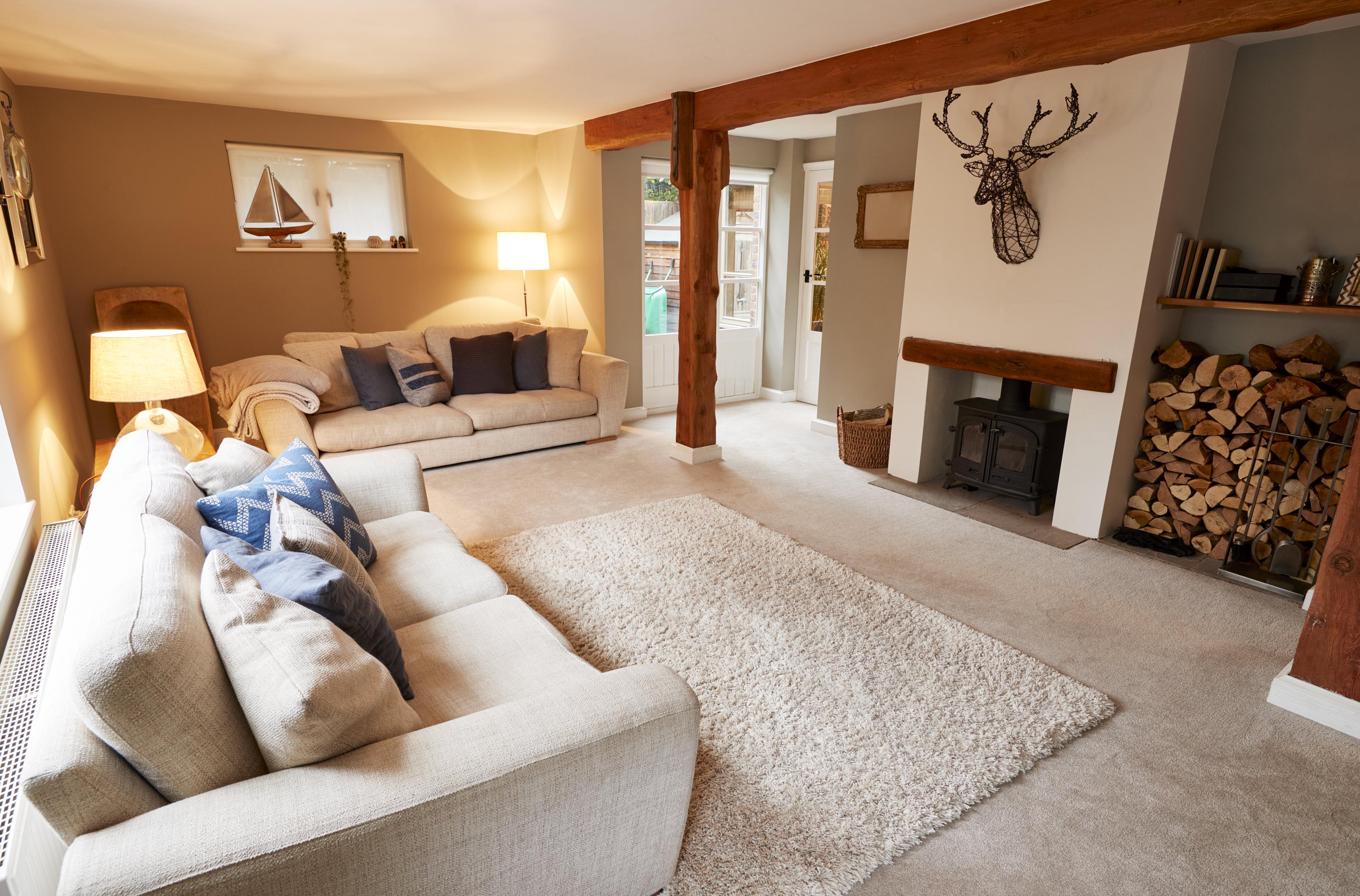 A warm lounge with a fireplace and cozy seating