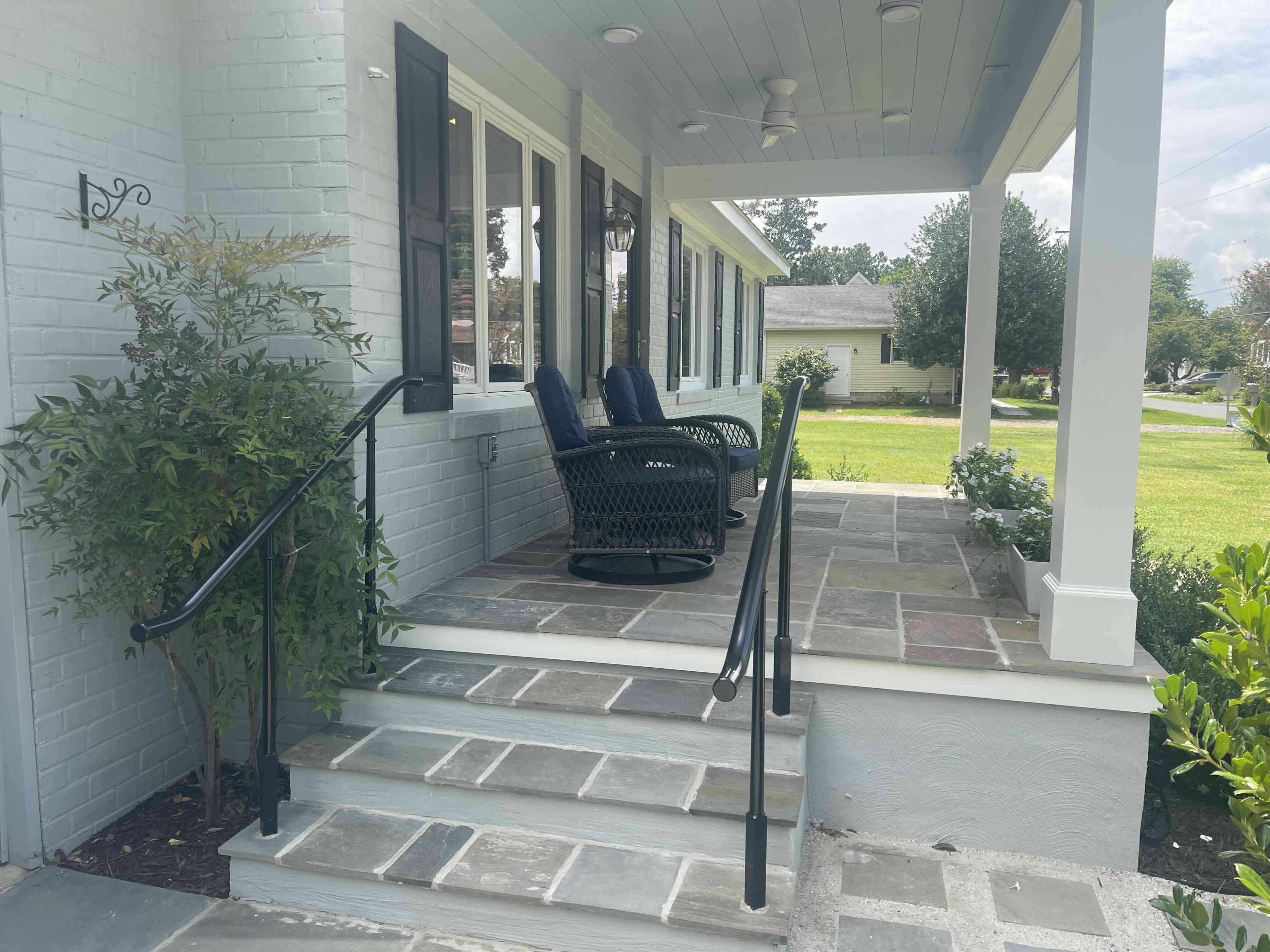 Bluestone porch steps and covered seating area